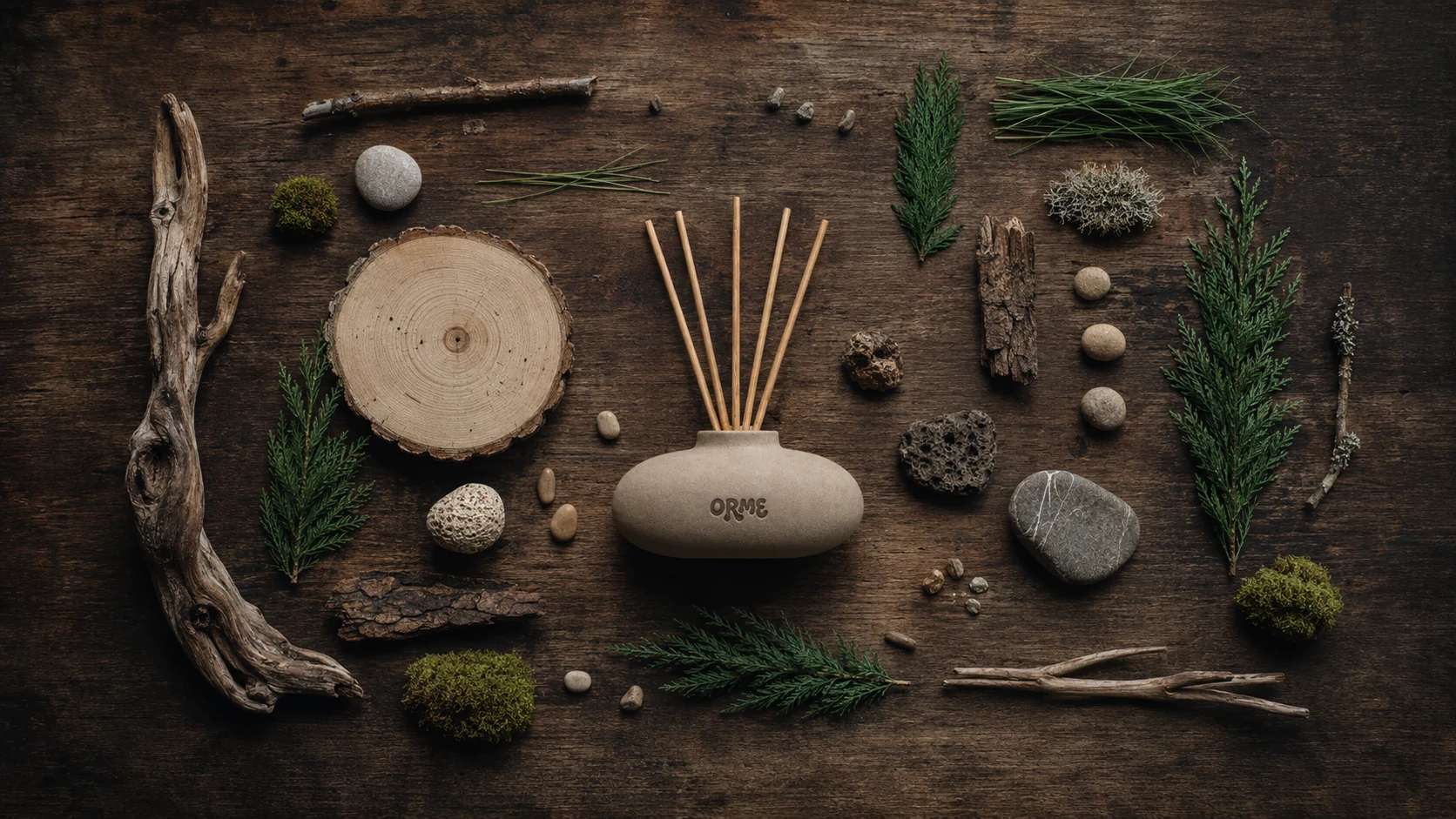 ORME ceramic diffuser with wood, stone, moss, and quiet natural materials
